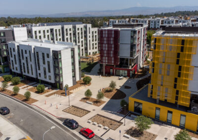 arial view of four colorful apartment highrises