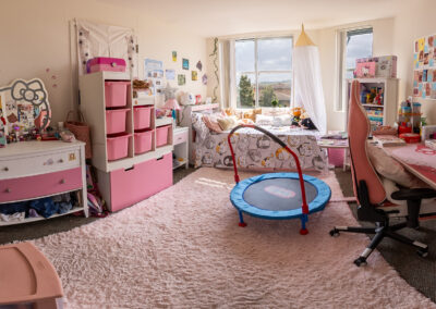 A you girls bedroom, artfully decorated with splashed of pink everywhere