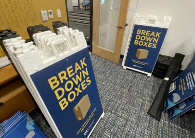 a-frame break down box signs sit in a storage room.